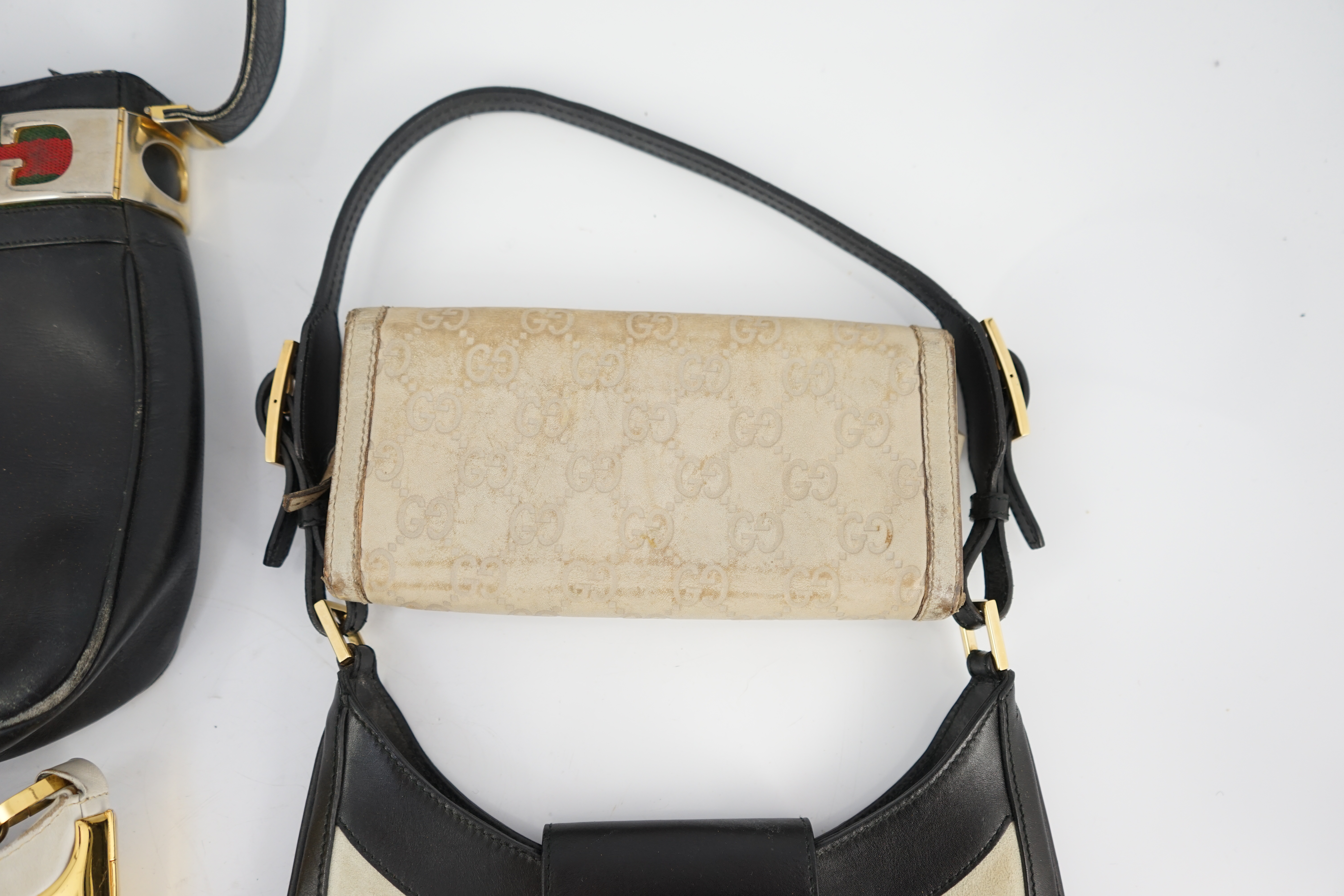 Three vintage Gucci hand bags and clutch wallet